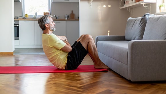 Man doing exercises to build and maintain muscle mass