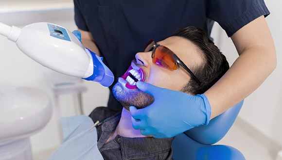 Man having his teeth whitened