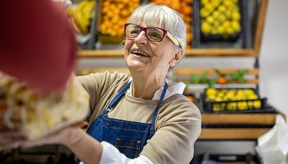 woman working in a greengrocer store