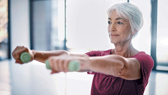 Woman doing weights for joint strength