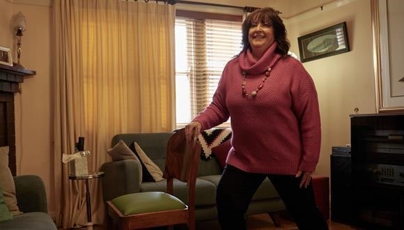 Janet doing exercises using a chair
