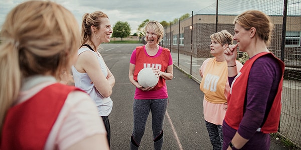 Women looking after their joint health during netball practise