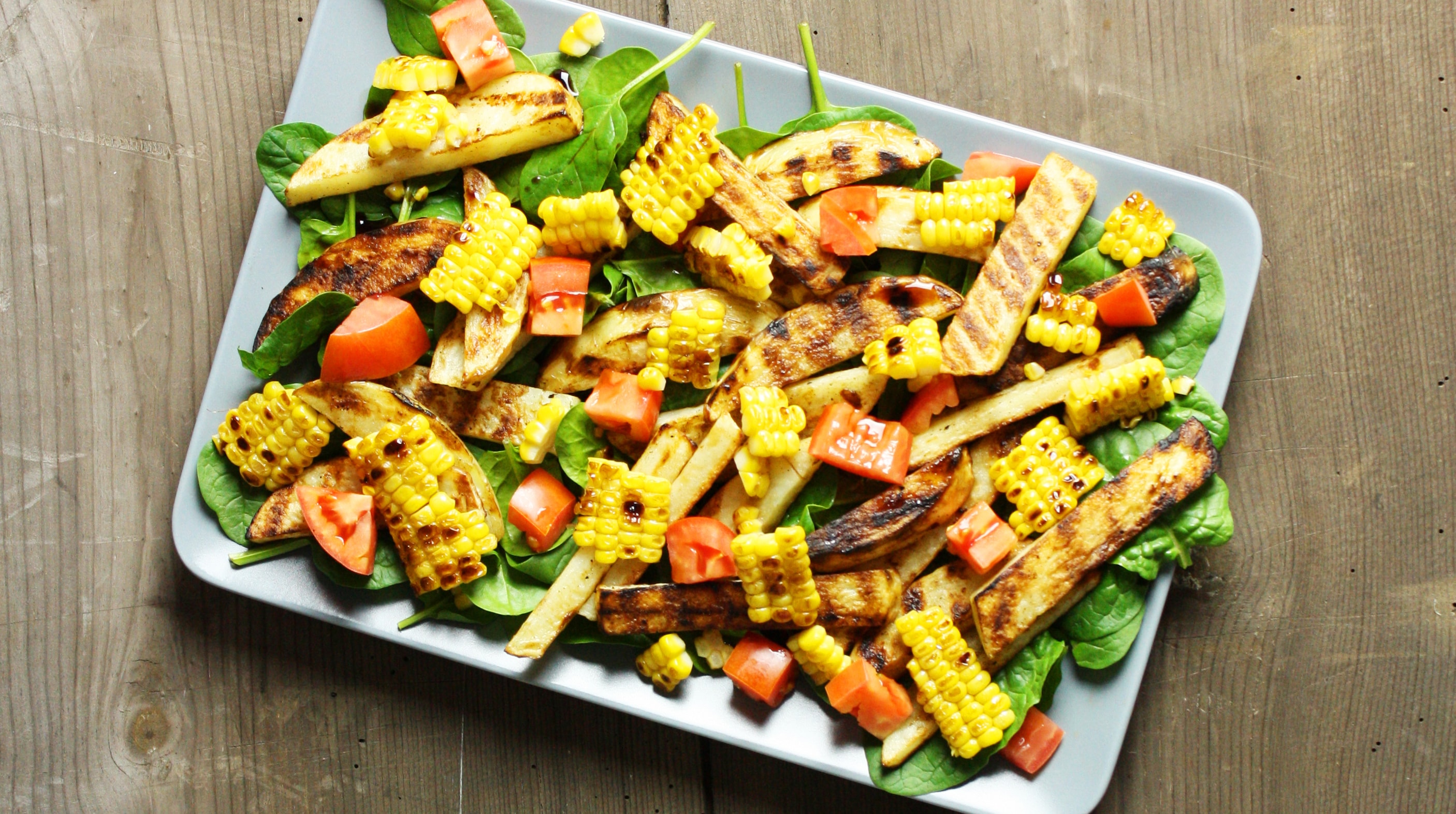 Grilled corn, potato & baby spinach salad
