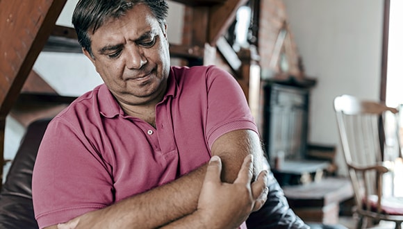 a man experiencing chest pain from a heart attack