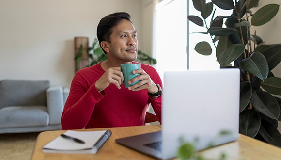 Man looking at his laptop screen