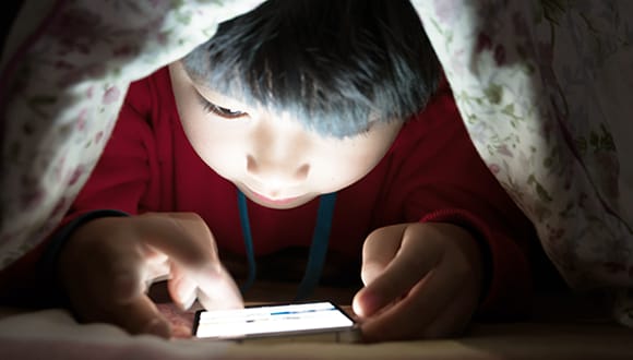 Child looking at mobile screen