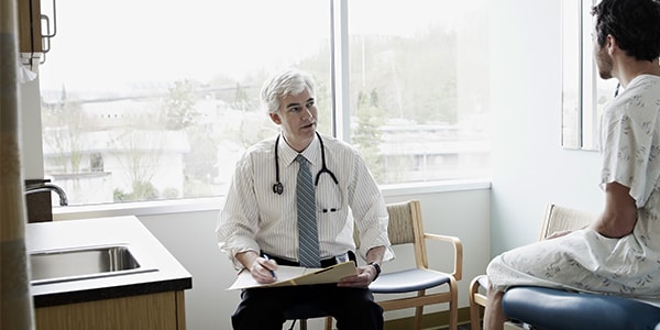 A doctor consulting a patient