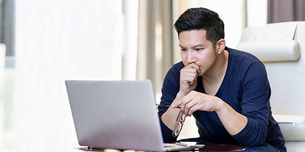 Man looking on laptop