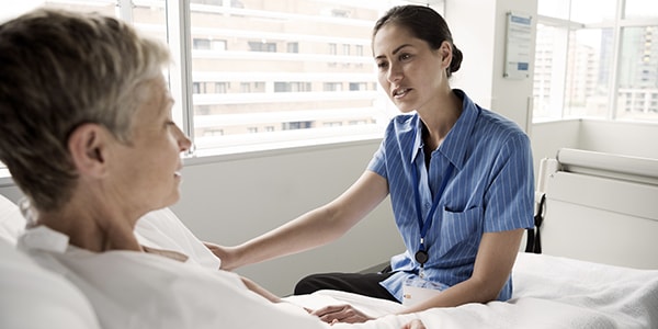 Nurse comforting patient