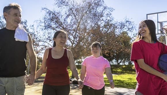 A group of people walking and doing incidental exercise