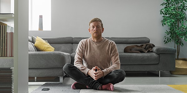 A man overcoming panic attacks using meditation