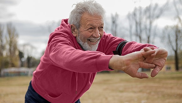 An older man exercising