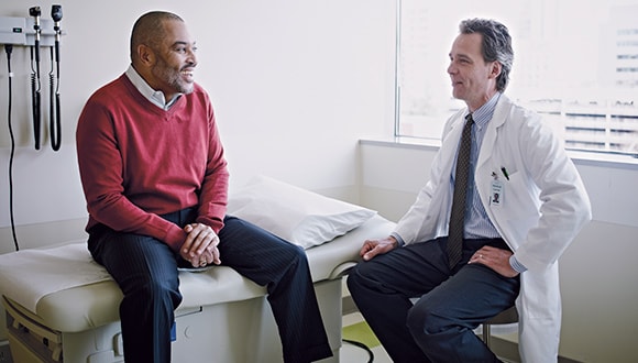 Man talking to his doctor about prostate health