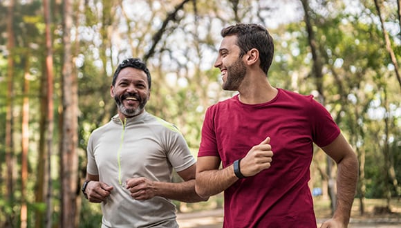 2 men running enjoying the benefits of running
