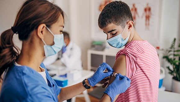 Boy getting a back to school vaccination