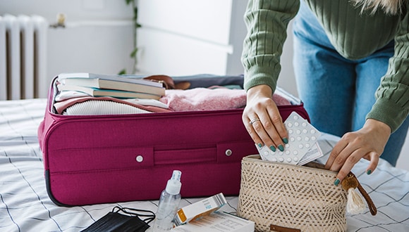 Woman packing her diabetes medication
