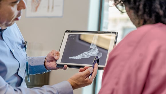 Lady getting a health check using her extras cover.