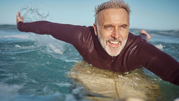Man surfing in the sun