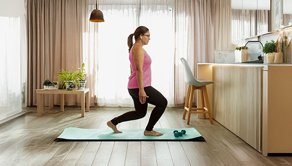 Woman doing exercises at home