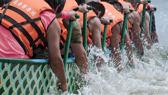 Team taking part in dragon boating to combat depression