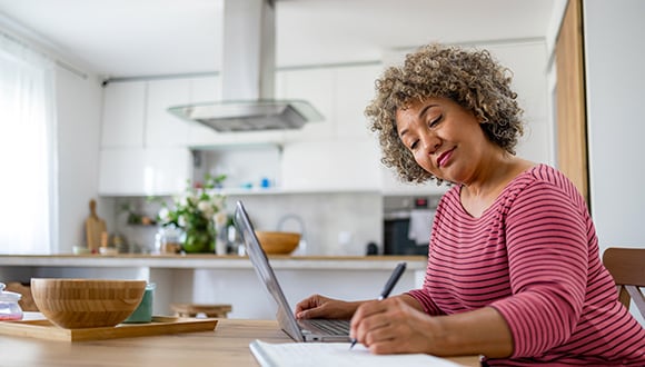 Woman in sitting at desk