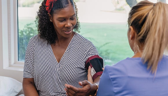 lady getting blood pressure check