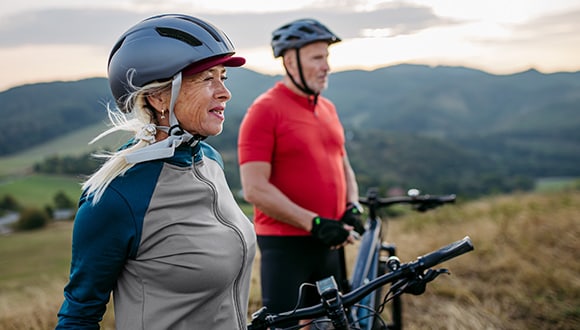 Man and woman mountain biking