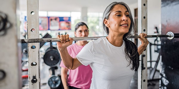 Two women exercising in the gym