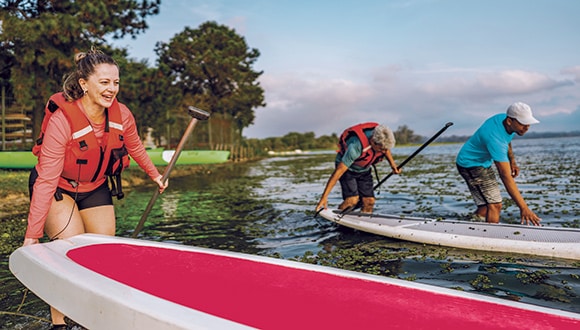 Family paddleboarding in the lake