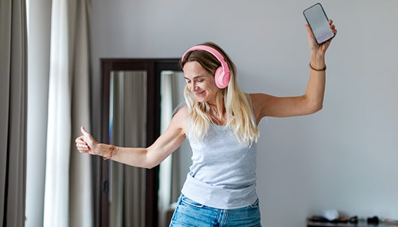 Lady dancing in her room as a form of exercise