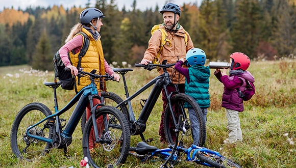 family going on a holiday riding bikes