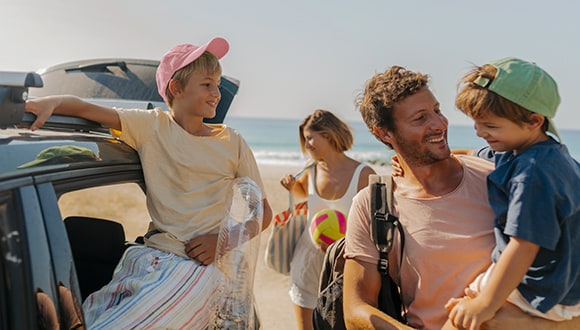 a family going on a holiday at the beach