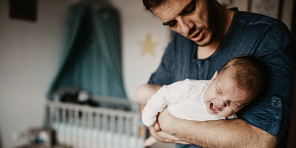 Father with crying baby that won't sleep