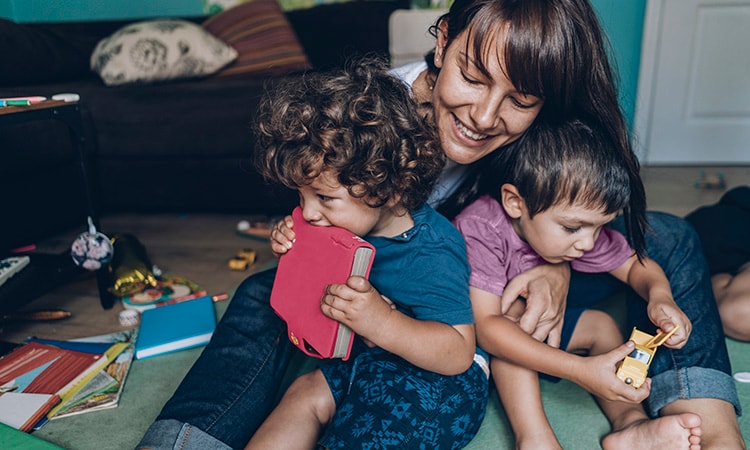 mum cuddling with kids