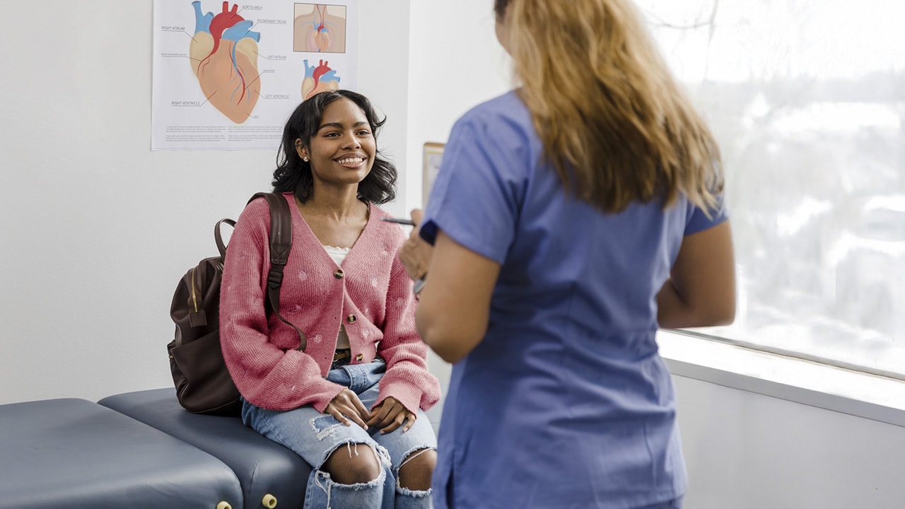 An international visitor having a consoltation with a doctor.