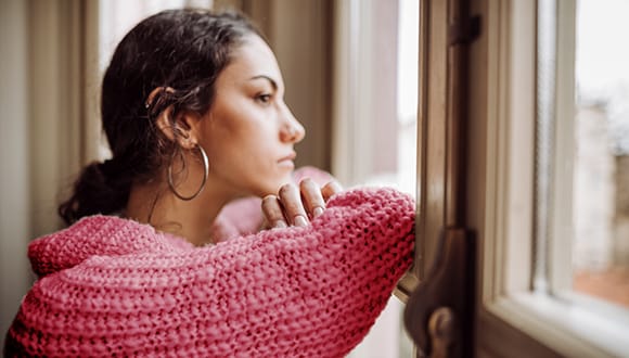 A woman looking out the window