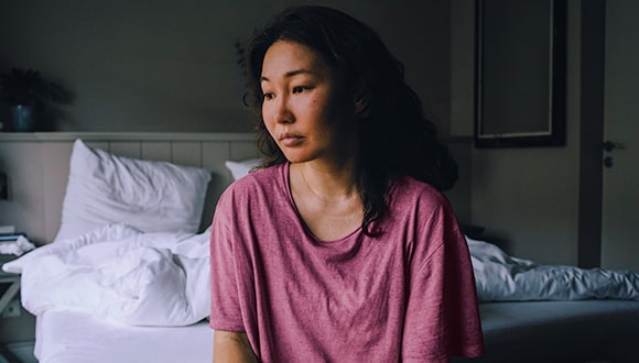 woman with insomnia having trouble sleeping