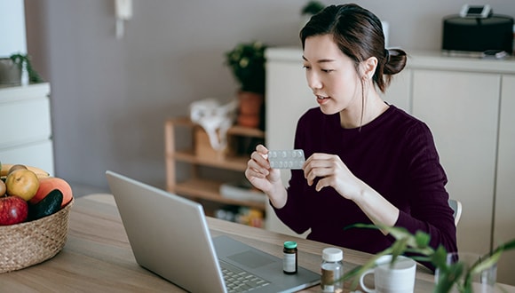 Woman doing online research on medications
