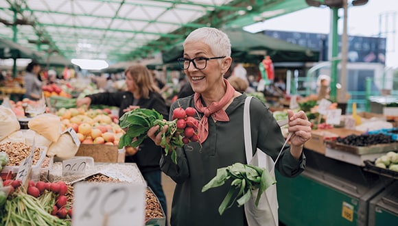 Lady shopping for healthy foods to try and lower her blood pressure