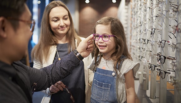 HCF eyecare staff helping customers