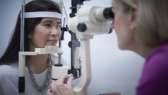 HCF eyecare staff performing a retinal scan