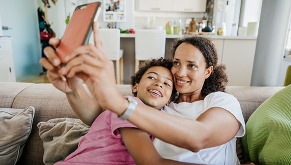 Woman taking a selfie with her son