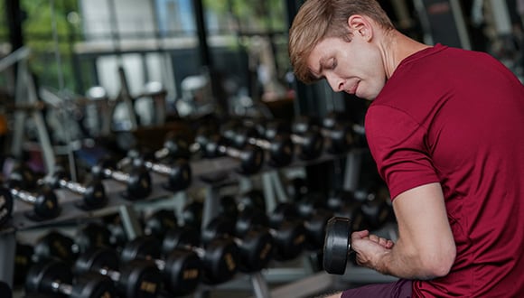 Man working out while battling body image issues