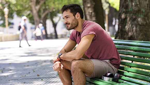 Man sitting on a bench in a park