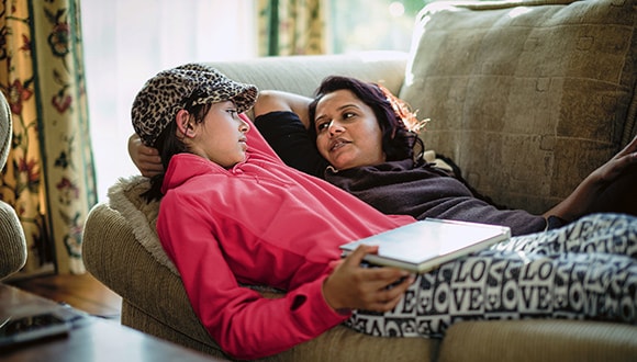 Mother and child on sofa