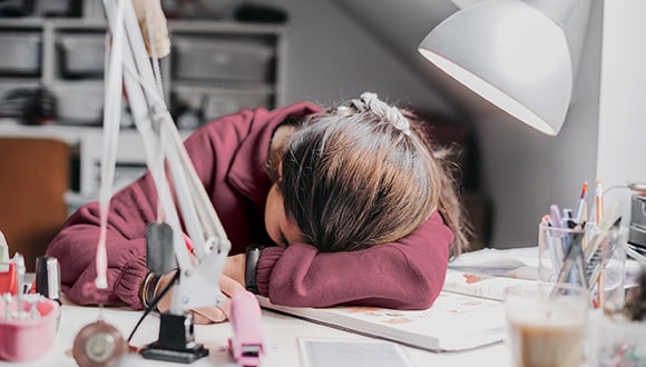 Tired lady with her head rested on the table