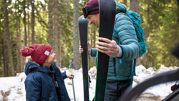 Man and daughter on a ski trip