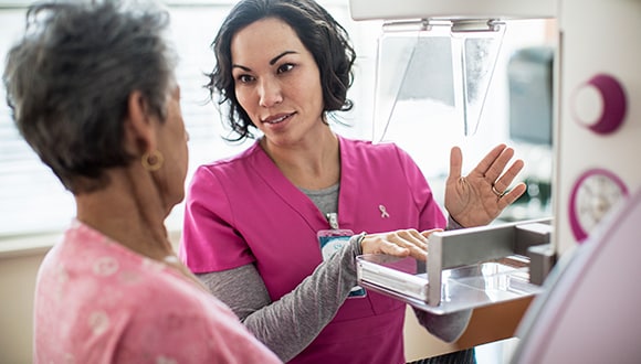A breast cancer patient getting a scan with a doctor
