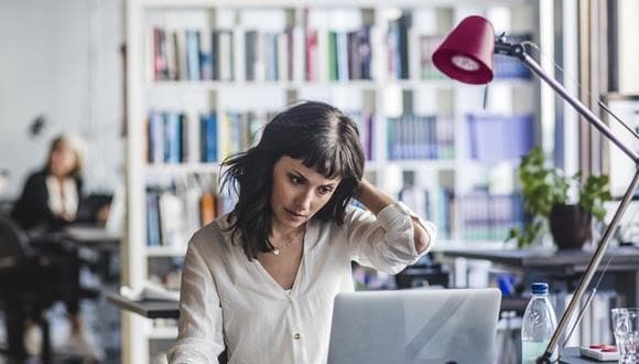 Woman on a laptop as a way to manage their anxiety