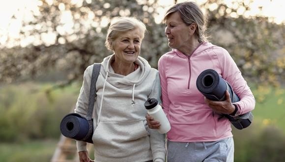 Two ladies exercising together to help manage their anxiety
